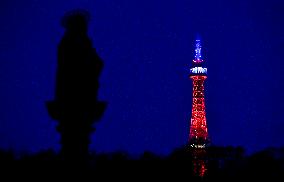 The lookout tower on Petrin hill lit in the French national colours