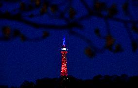 The lookout tower on Petrin hill lit in the French national colours
