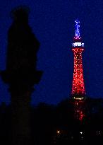 The lookout tower on Petrin hill lit in the French national colours