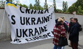 Protest against ride of Night Wolves in Prague, BANNER CRIMEA IS UKRAINE and UKRAINE is EUROPE