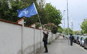 Protest against ride of Night Wolves in Prague, flag of NATO