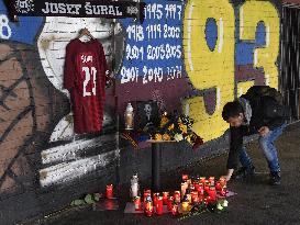 people light candles in memory of Josef Sural