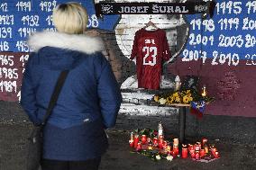 people light candles in memory of Josef Sural