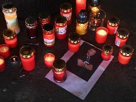 people light candles in memory of Josef Sural