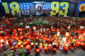 people light candles in memory of Josef Sural