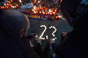 people light candles in memory of Josef Sural