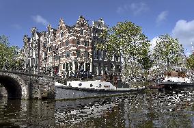 Amsterdam, center of the city, bikes, bicycles, parking, people, tourist, tourists, tourism, boat