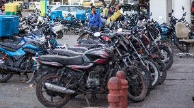 man, phone, parking, lot, motorbike, motorbikes, Connaught Place