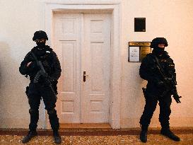 The heavily armed member of Prison Service and Police of the Czech Republic guard entrance to the court room