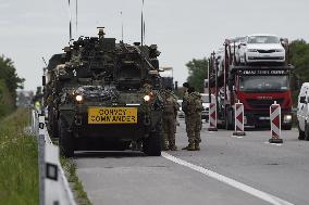 Lorry collides with military vehicle, U.S. convoy