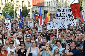 People attend a demonstration in Brno