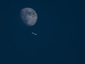 Airplane and Moon