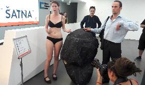 Greenpeace activist in coal costume as a minority shareholder tries to enter annual general meeting of the CEZ Group