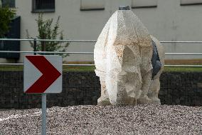 statue of rhino in centre of road circle, representing Sudan, the late last northern white rhinoceros male in the world