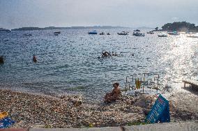 Hvar, promenade, swimming, tourists