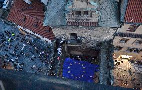 March to Hradcanske Square, demonstration, Million Moments for Democracy, Charles Bridge, EU flag