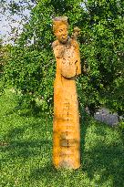 Stara Hora and Kojiny at Vlcnov, traditional wine cellars, wooden statue