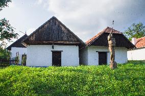 Stara Hora and Kojiny at Vlcnov, traditional wine cellars, wooden statue