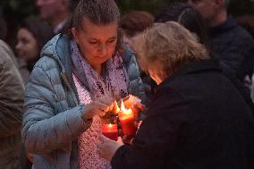 people light candles in front of Karel Gott's house in Prague