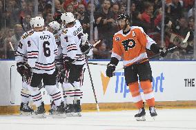 Blackhawks players celebrate the first goal