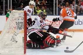 Dennis Gilbert, Corey Crawford, Claude Giroux