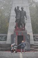 Red Army monument splashed with red colour