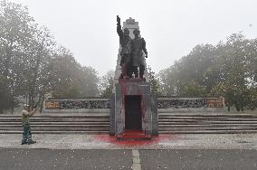 Red Army monument splashed with red colour