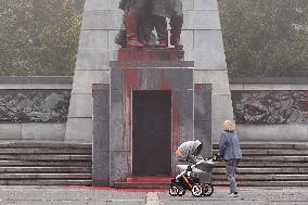 Red Army monument splashed with red colour