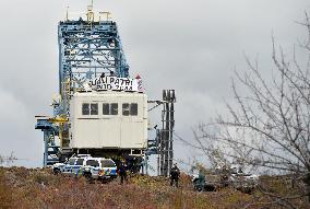 activists block coal mine excavator in protest of mine sale