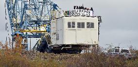 activists block coal mine excavator in protest of mine sale