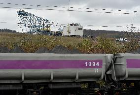 activists block coal mine excavator in protest of mine sale