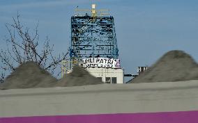 anti-coal power activists occupying excavator for third day