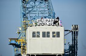 anti-coal power activists occupying excavator for third day