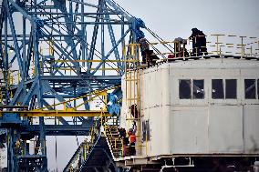 anti-coal power activists occupying excavator for third day