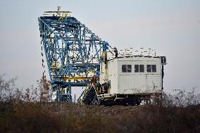 anti-coal power activists occupying excavator for third day