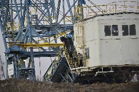 anti-coal power activists occupying excavator for third day