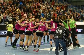 Slovenian players celebrate after winning the match