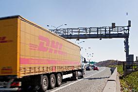 highway, toll bridge, truck, DHL