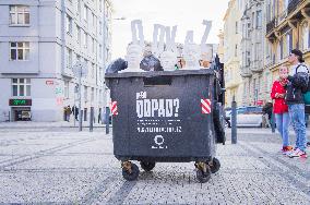 garbage container full of waste and busts of Jan Hamacek, PM Andrej Babis and Richard Brabec, Heritage or Waste campaign