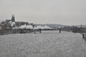 Steam locomotive on Vysehrad railway bridge over the Vltava River