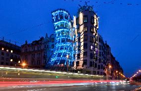 the Dancing House lit in the turquoise colour of the UNICEF