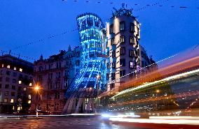 the Dancing House lit in the turquoise colour of the UNICEF