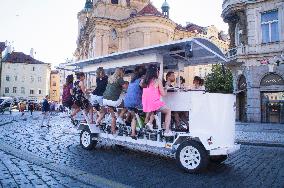 beer bike, car, tourists, Old Town Square