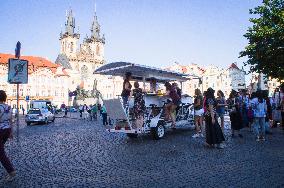 beer bike, car, tourists, Old Town Square