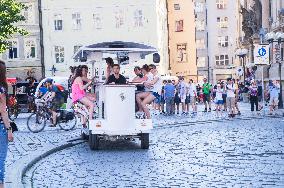 beer bike, car, tourists, Old Town Square