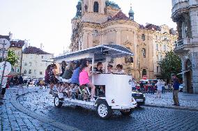 beer bike, car, tourists, Old Town Square