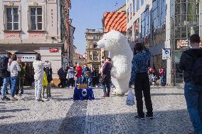 Wenceslas Square, tourists, giant inflatable polar bear mask