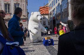 Wenceslas Square, tourists, giant inflatable polar bear mask