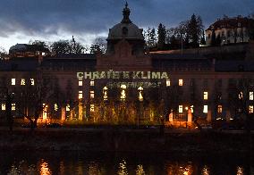 Greenpeace activists project message for CzechPM on government building in Prague