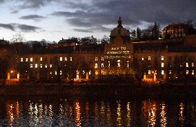 Greenpeace activists project message for CzechPM on government building in Prague